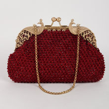 Odette Peacock Curved Shinny Maroon Clutchpurse